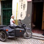 man in bike with sidecar