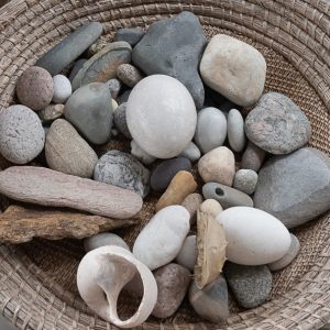 shells and stones on mat