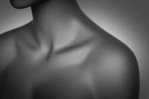 A neck and shoulders from the front