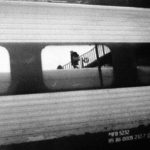 Reflection of woman on subway car