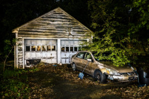 Abandoned garage and car